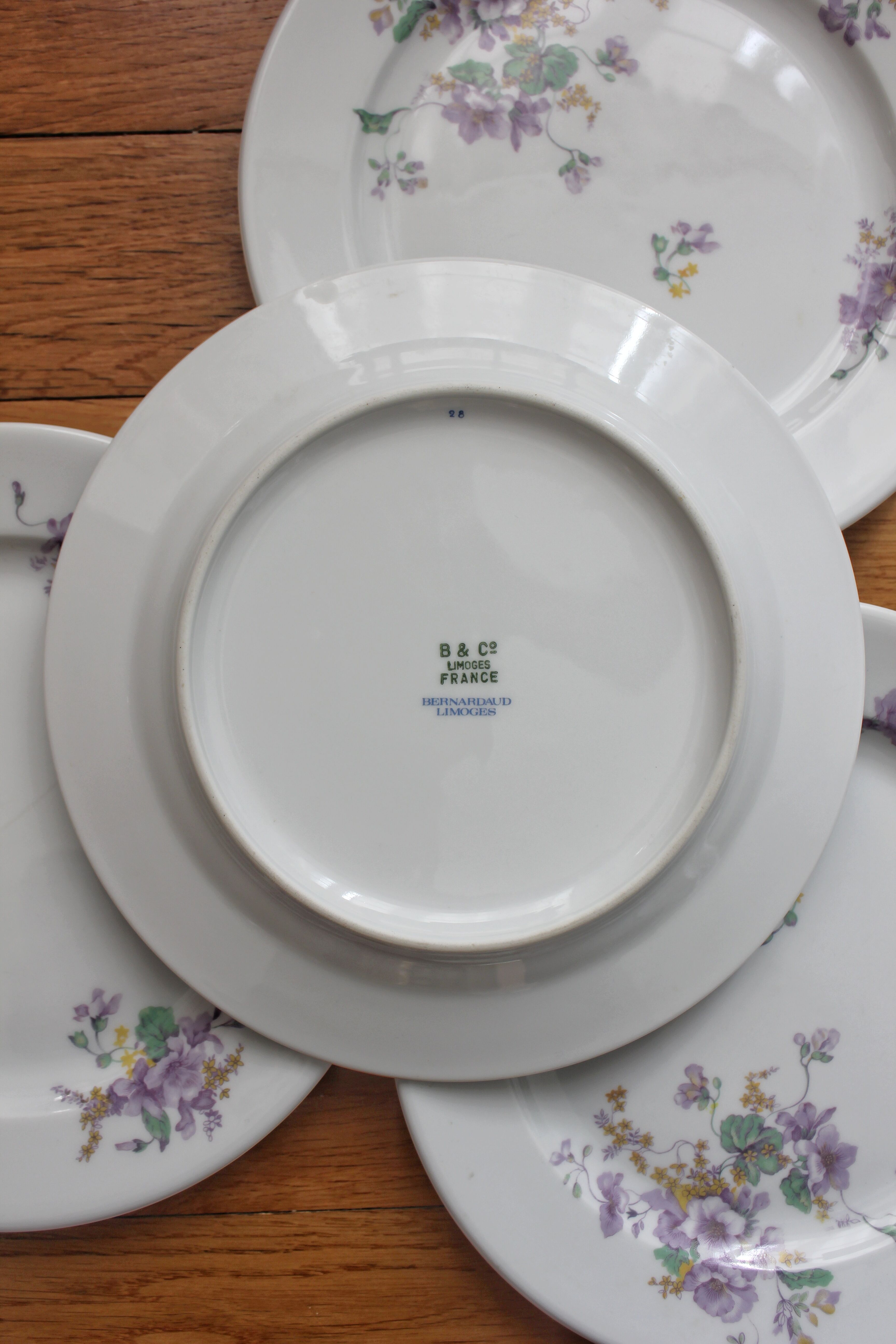 4 porcelain dessert plates decorated with flowers Bernardaud Limoges