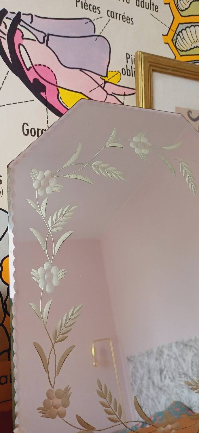 Beveled mirror with floral decor