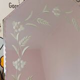 Beveled mirror with floral decor