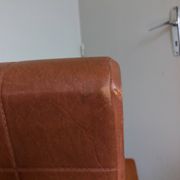 Scandinavian armchair in brown leatherette and wood