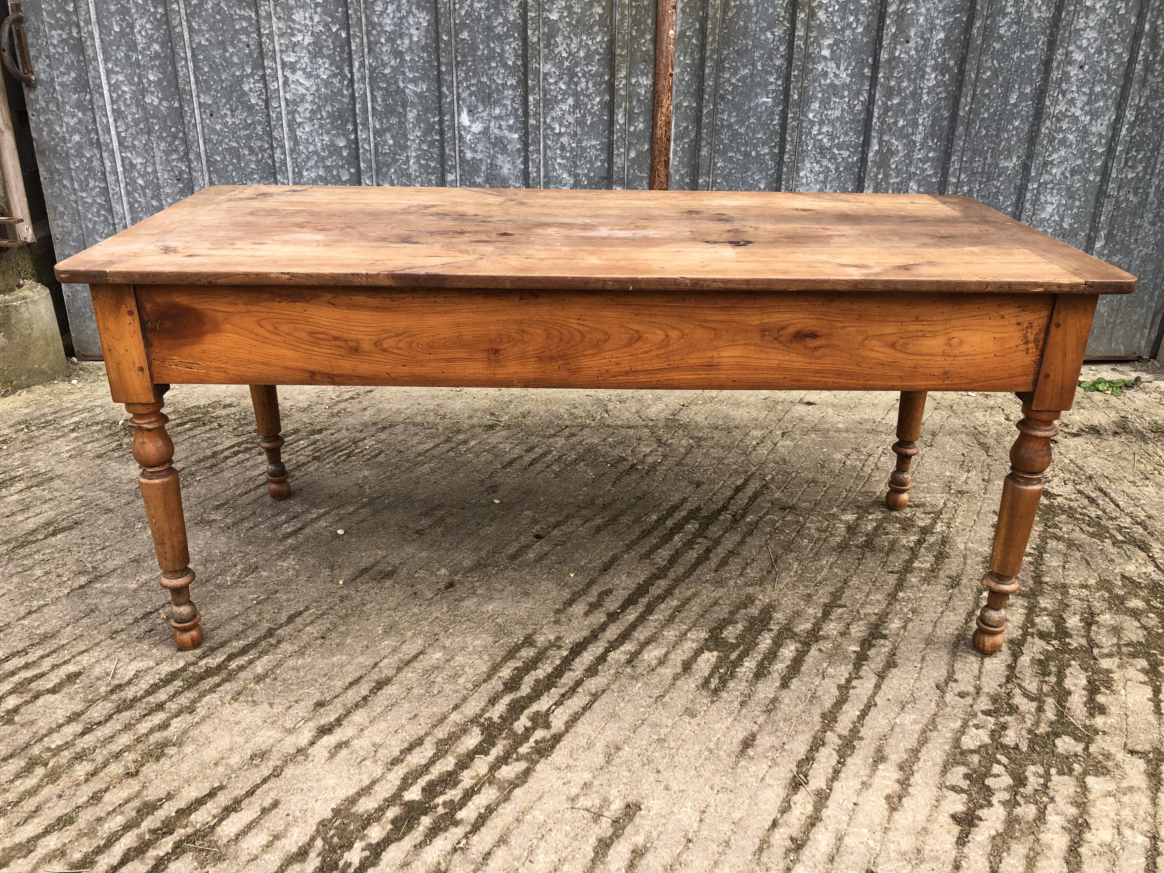 Antique cherry farmhouse table with 2 drawers and 1 pull-out