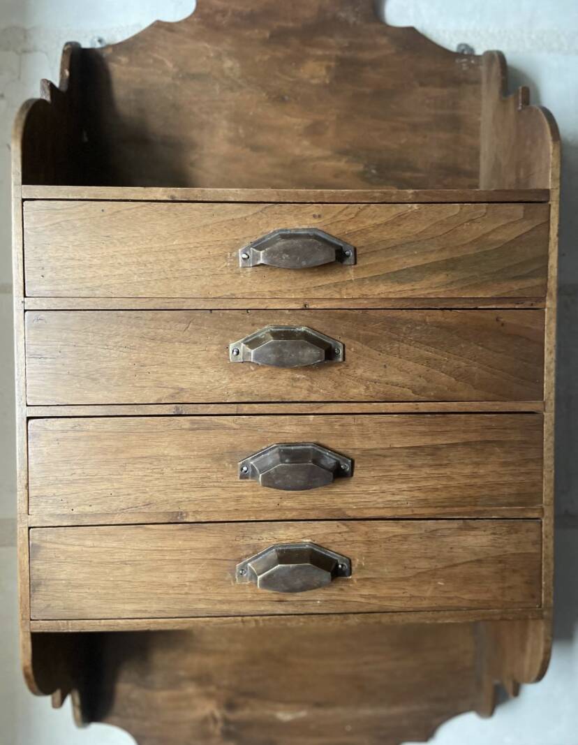 Antique piece of furniture with walnut drawers to hang