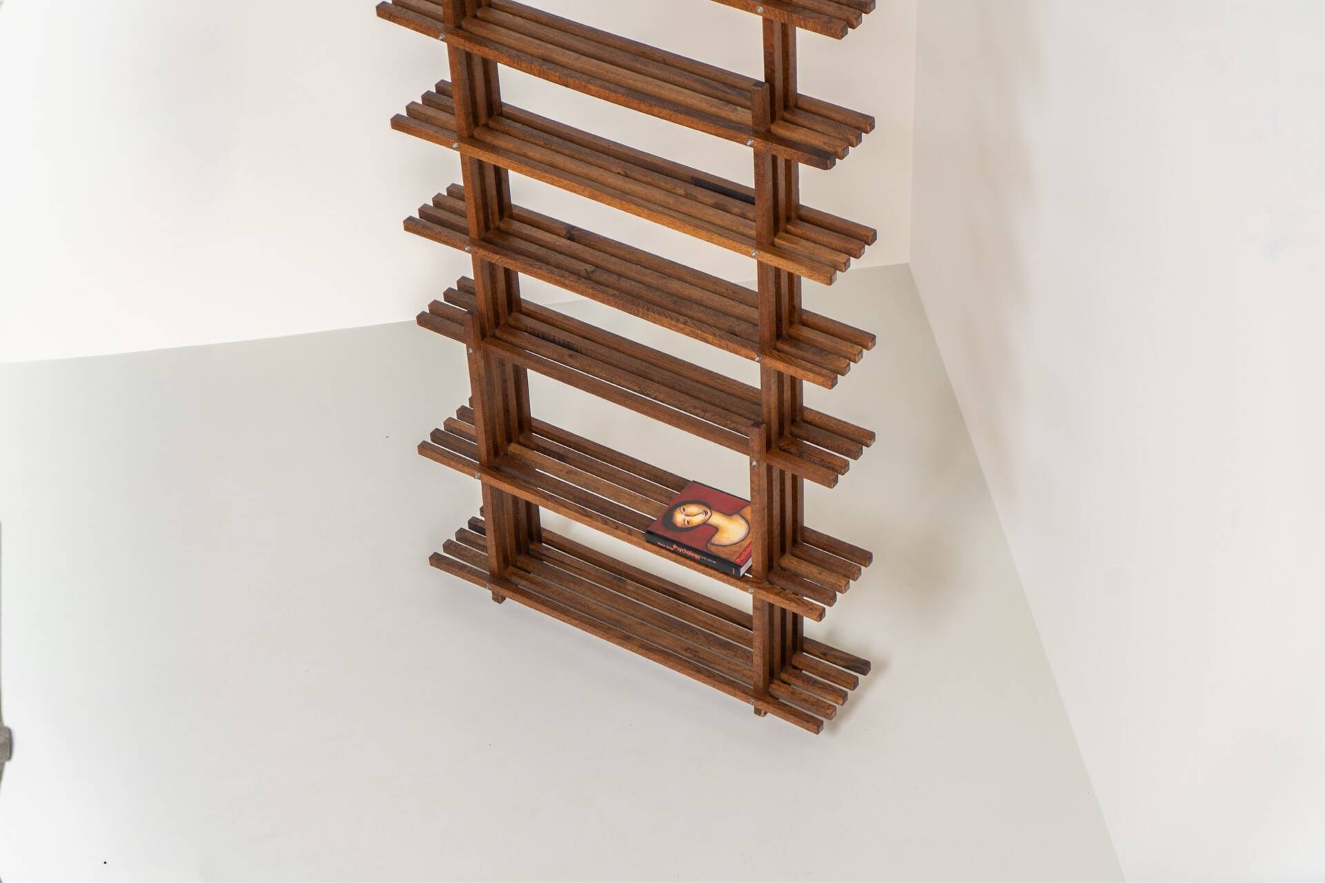 Sculptural wengé slat bookcase (Europe, 1960s).