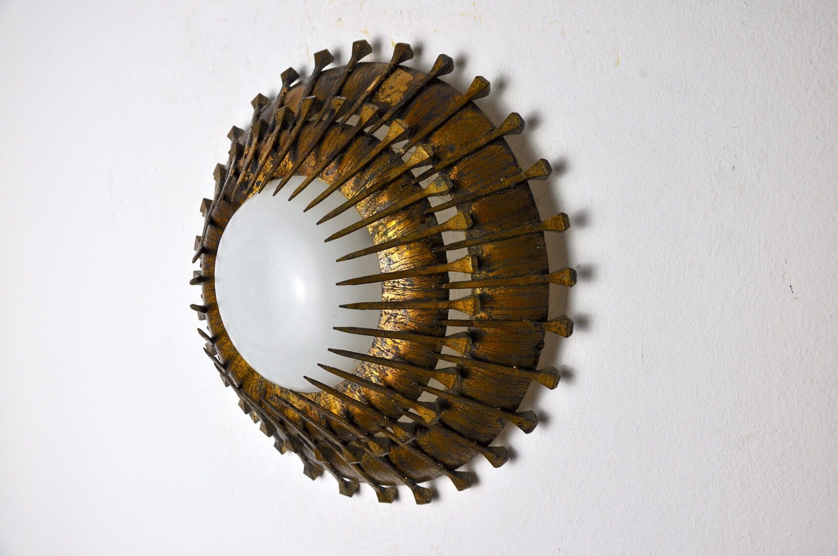 Midcentury brutalist sun wall lamp, metal and gold leaf, Italy