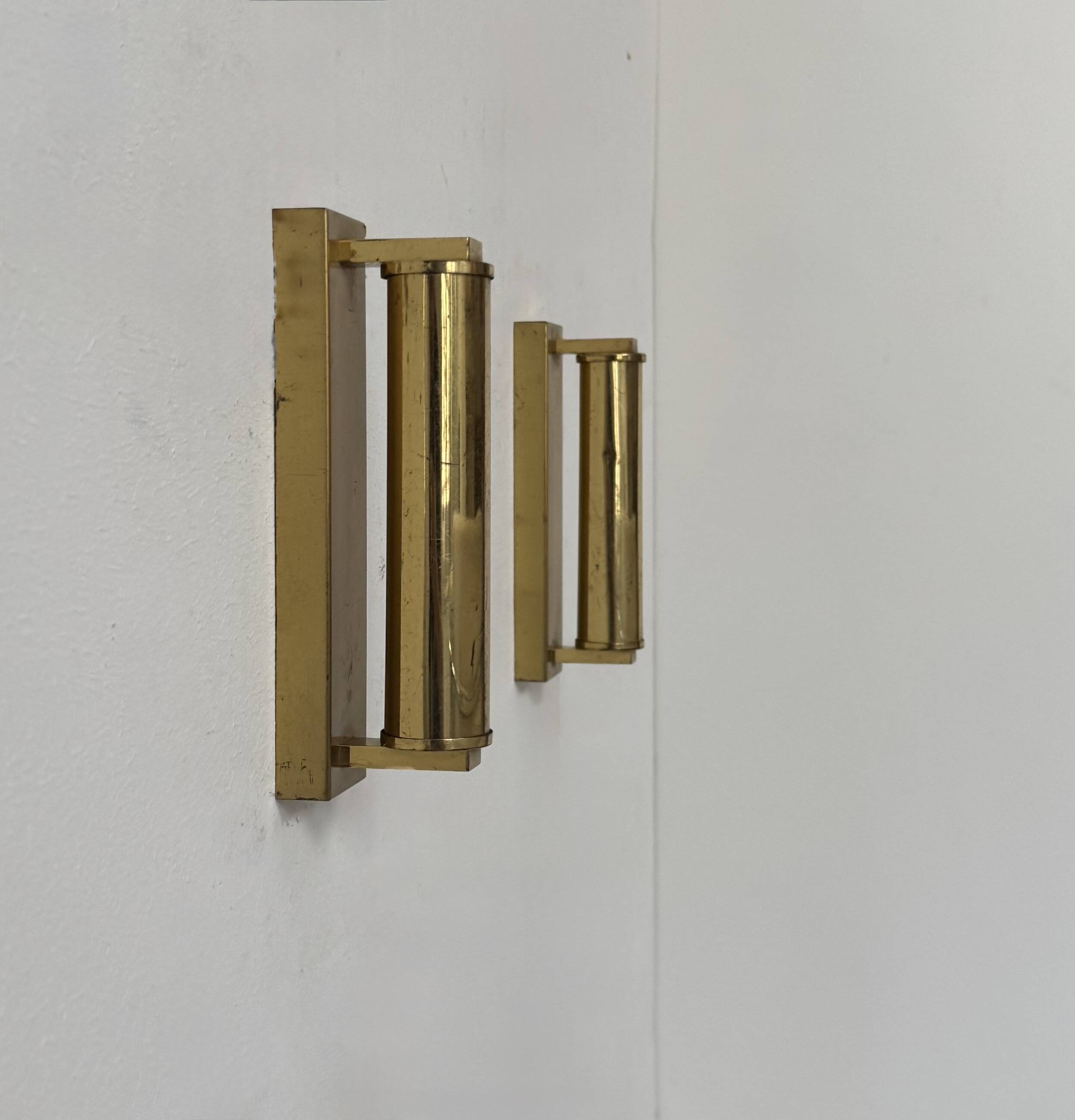 Pair of vintage modernist adjustable wall lights, brass, France 1970.