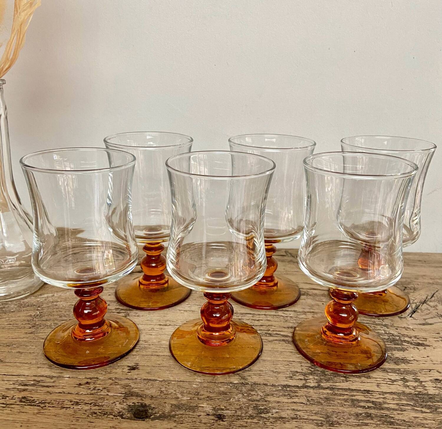 6 small amber stemmed glasses