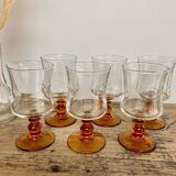 6 small amber stemmed glasses