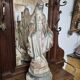 Garden statue of the Virgin Mary in old reconstituted stone