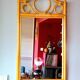 Curved wooden mirror and rattan