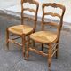 2 chaises bois massif et paillées style Louis XV sculpture coquille