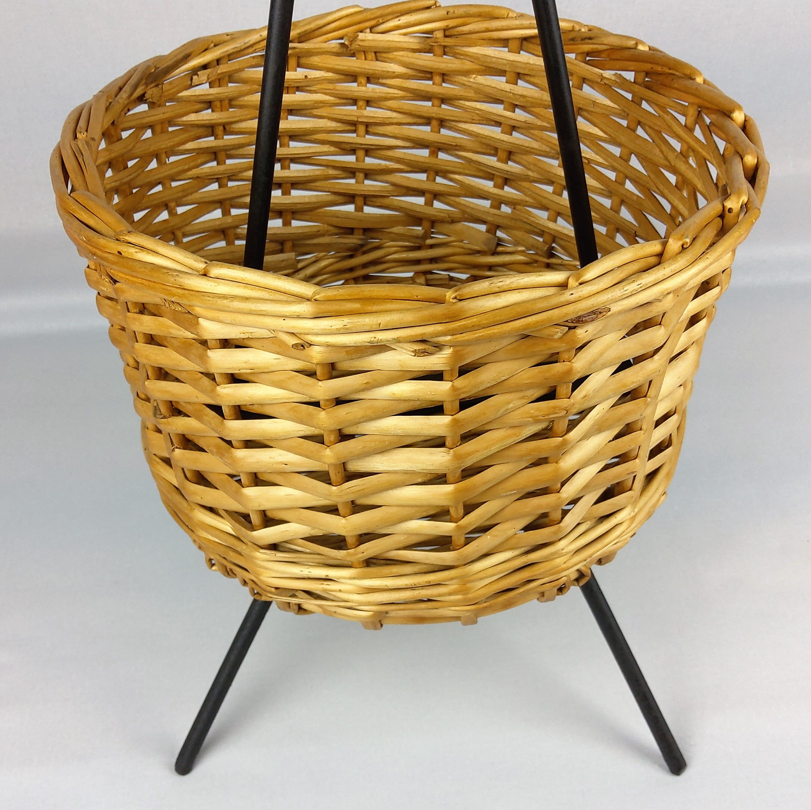 Black metal rattan trash can on 1960