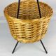 Black metal rattan trash can on 1960