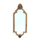 Old small wall mirror in golden resin
