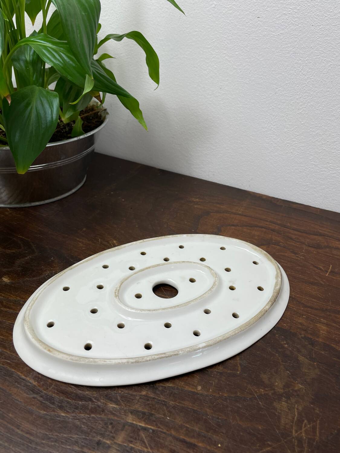 Old iron clay draining plate
