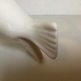 White earthenware sea lion in piggy bank