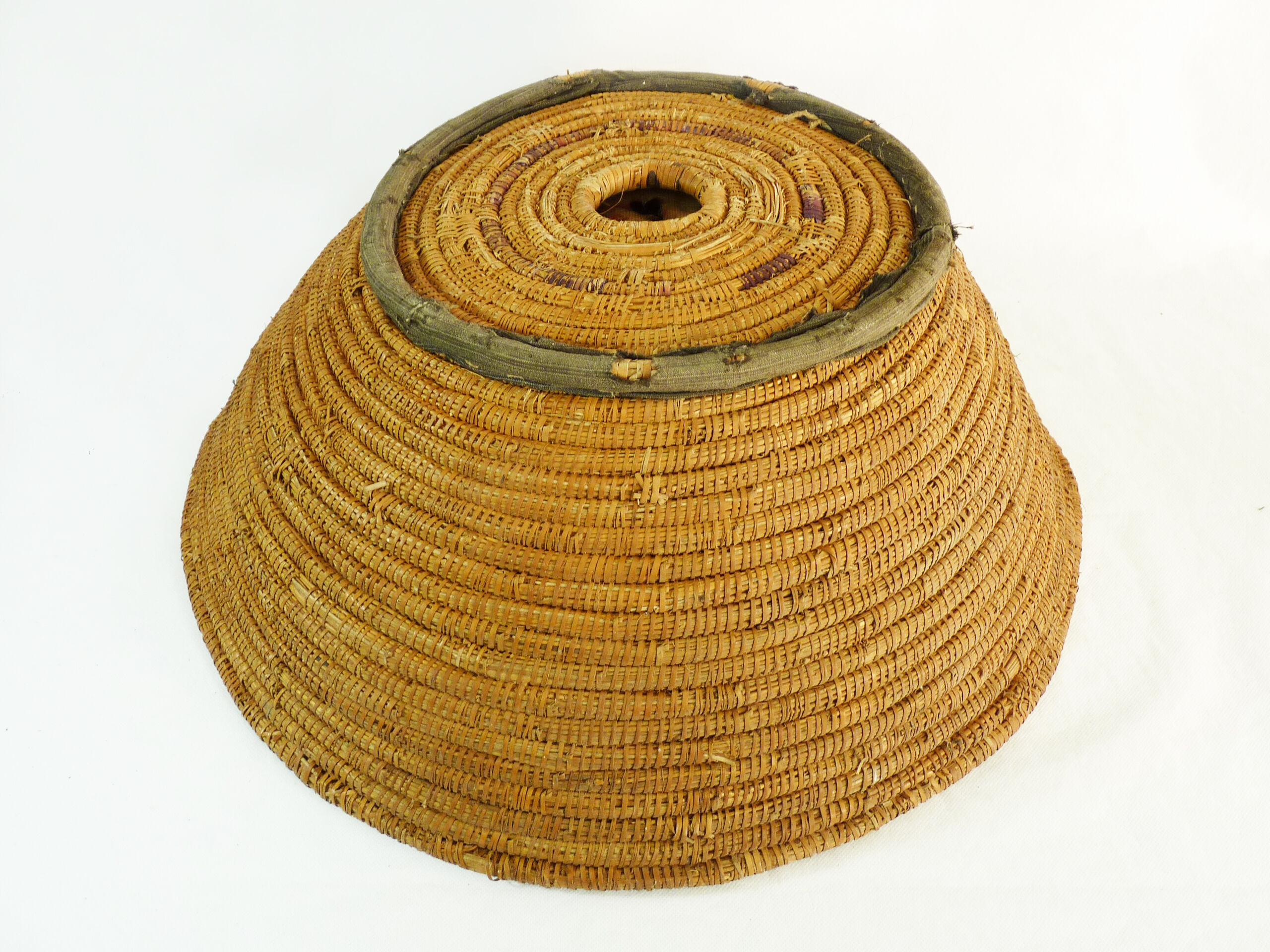 Old large bread basket of baker in braided wicker