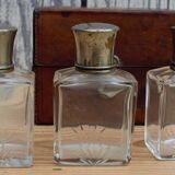 Antique leather case with 3 beveled bottles