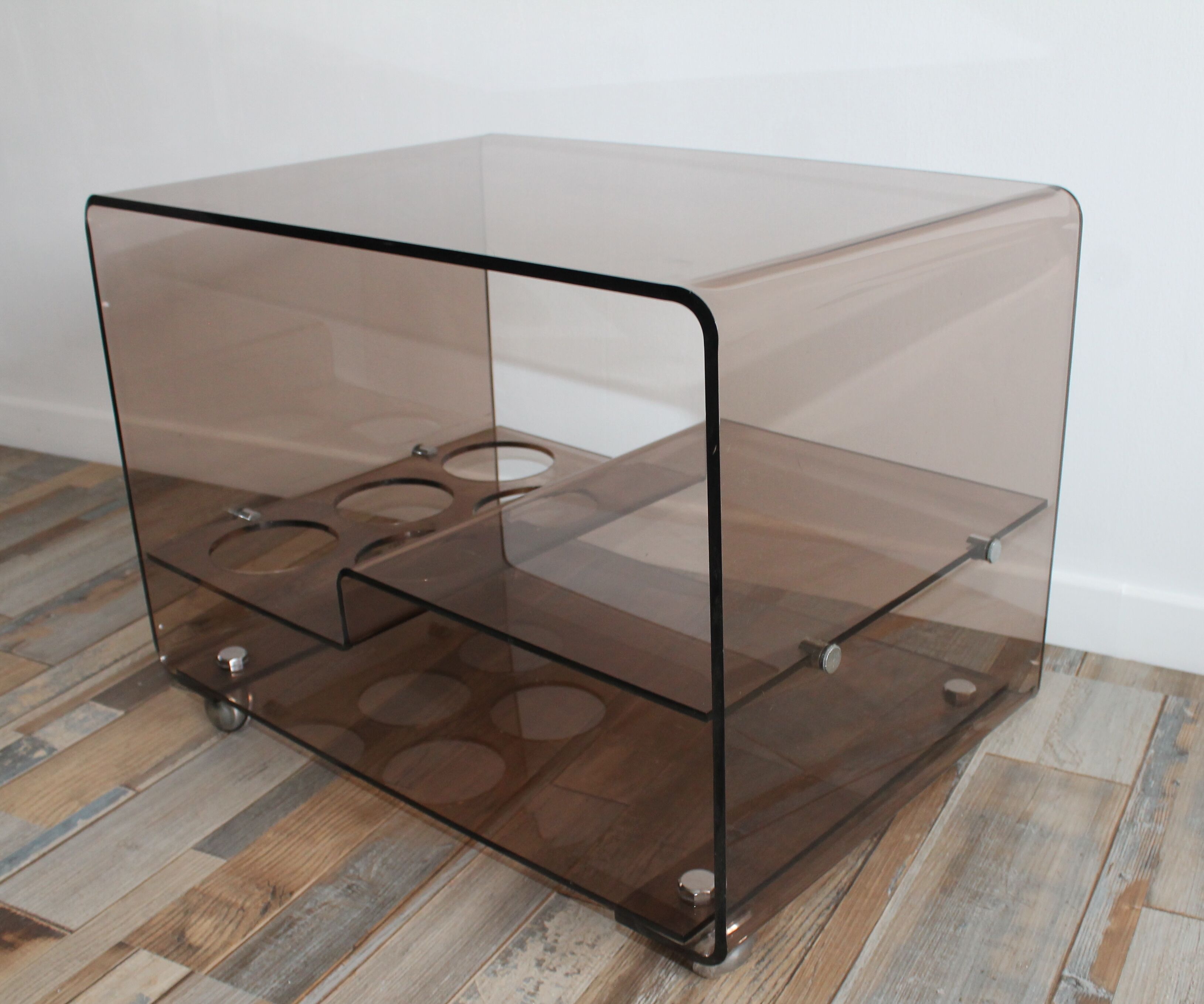 Low table served on wheels by Michel Dumas in vintage 1970 smoky Plexiglas