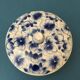 Porcelain candy dish. Blue flower patterns on white background