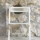 Vintage perforated metal folding chair