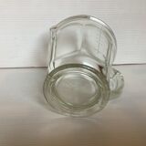 Old glass measuring pitcher