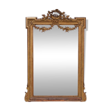 Large mirror in a gold frame, France.