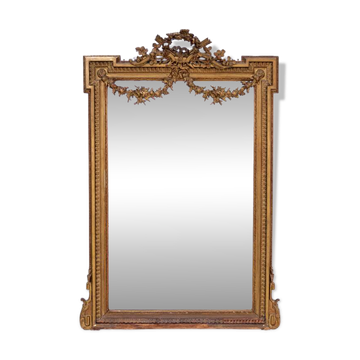 Large mirror in a gold frame, France.