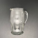 Glass jug with chiseled pattern