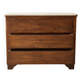 Antique solid wood chest of drawers with a white marble top.