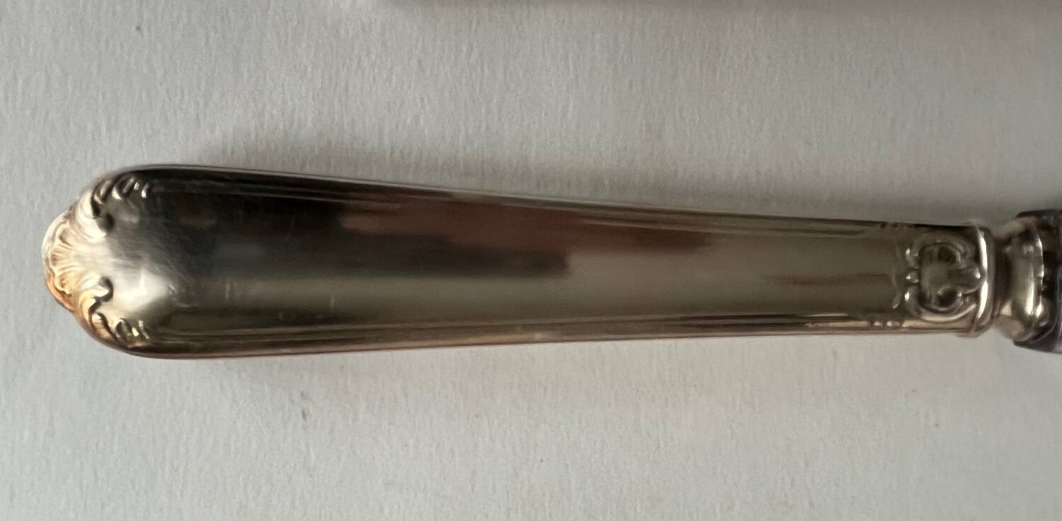 12 silver metal knives