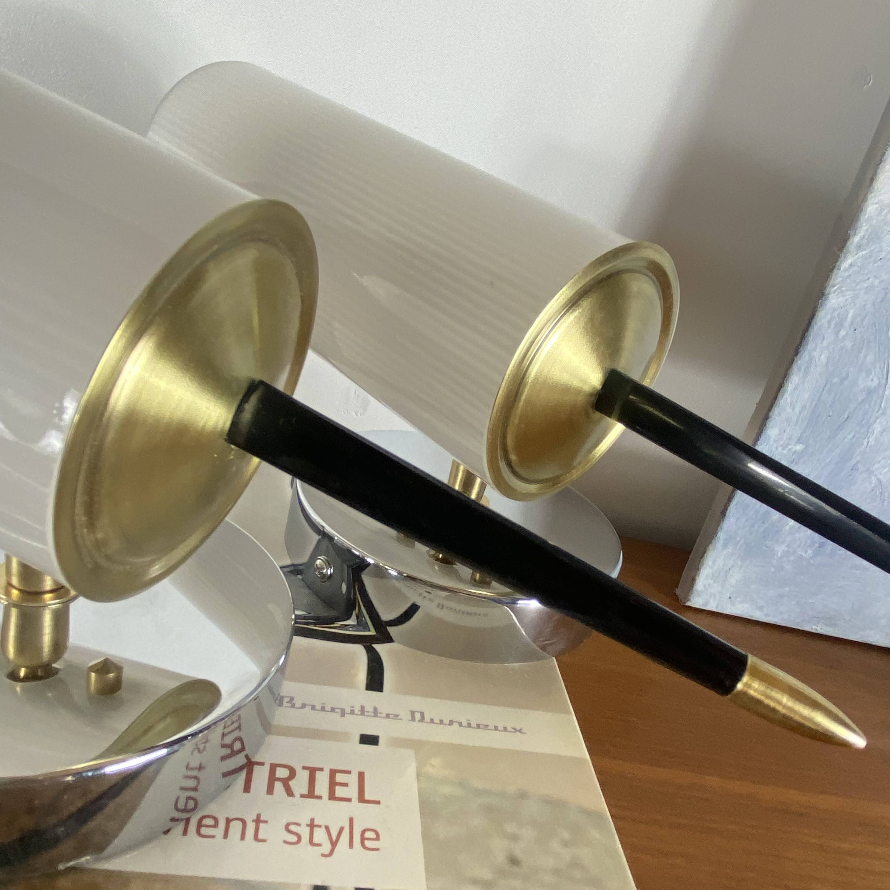 Pair of vintage wall sconces in plexiglass plastic and brass.