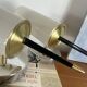 Pair of vintage wall sconces in plexiglass plastic and brass.