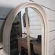 Oval mirror in white lacquer from the 1970s.