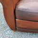 Paire de fauteuils club en cuir brun des années 30