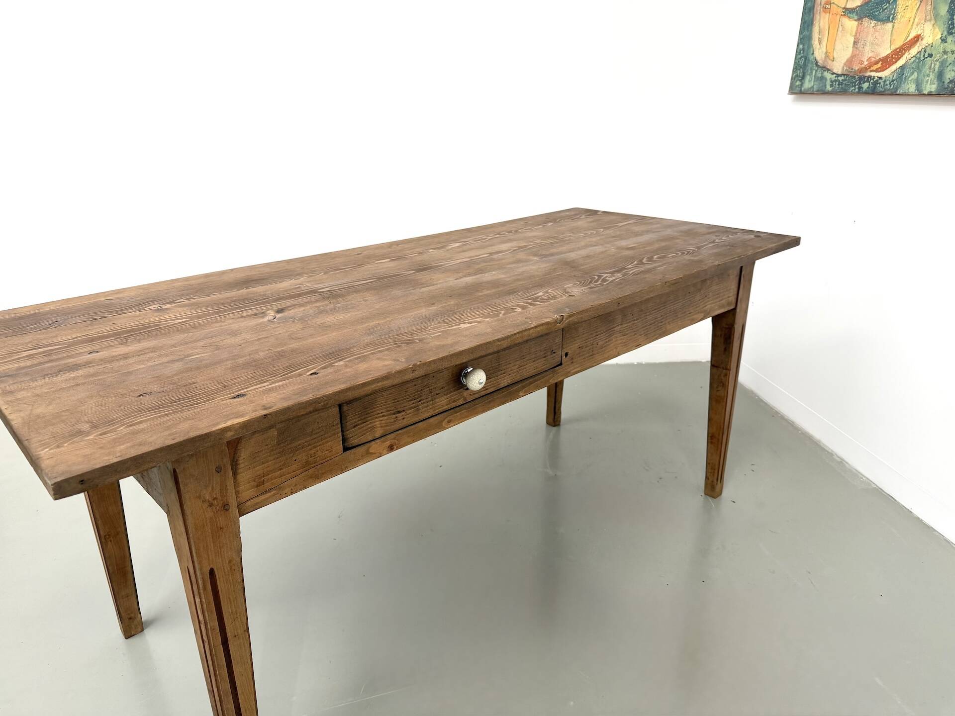 Solid pine farmhouse table, two drawers, fluted legs, France.