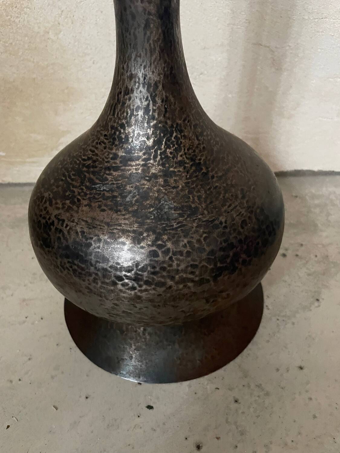 Hammered metal vase