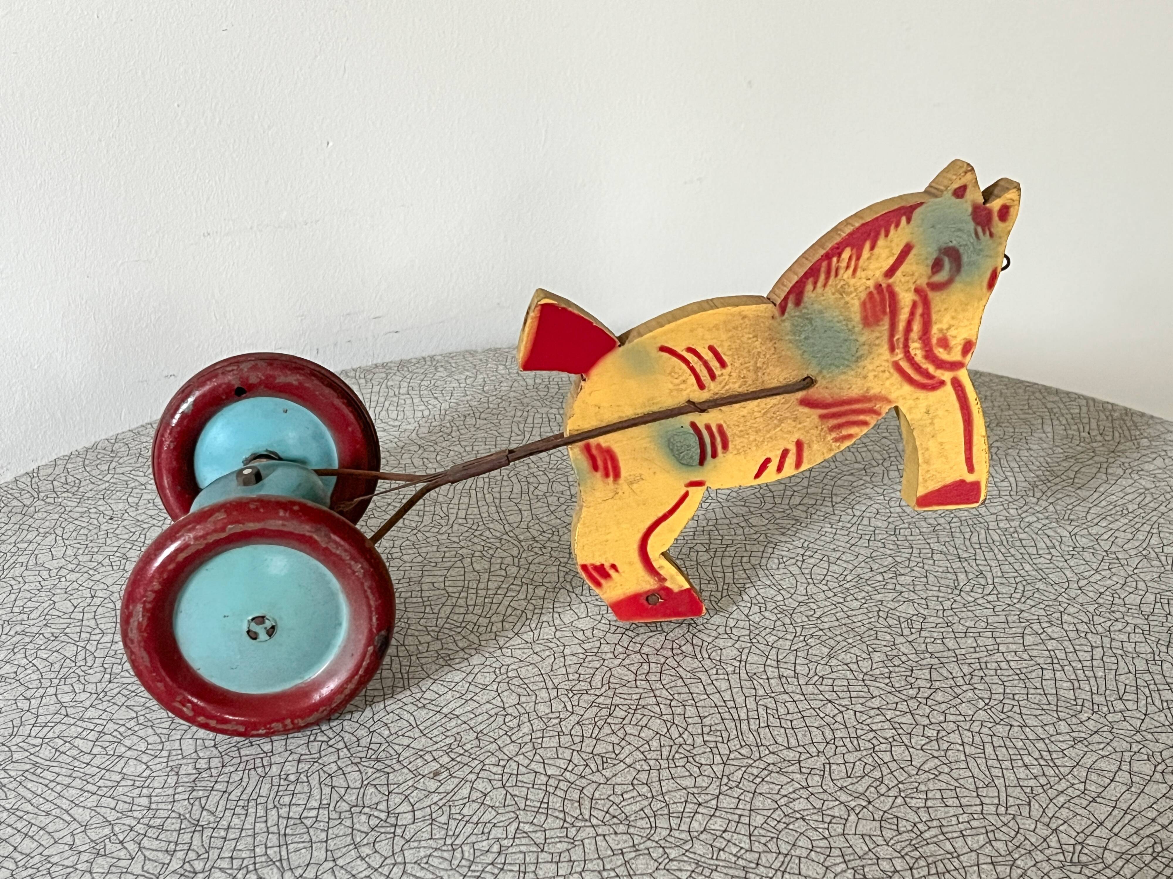 Vintage pull-along toy, horse-drawn with a bell, musical toy