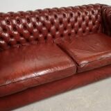 Old red leather Chesterfield sofa