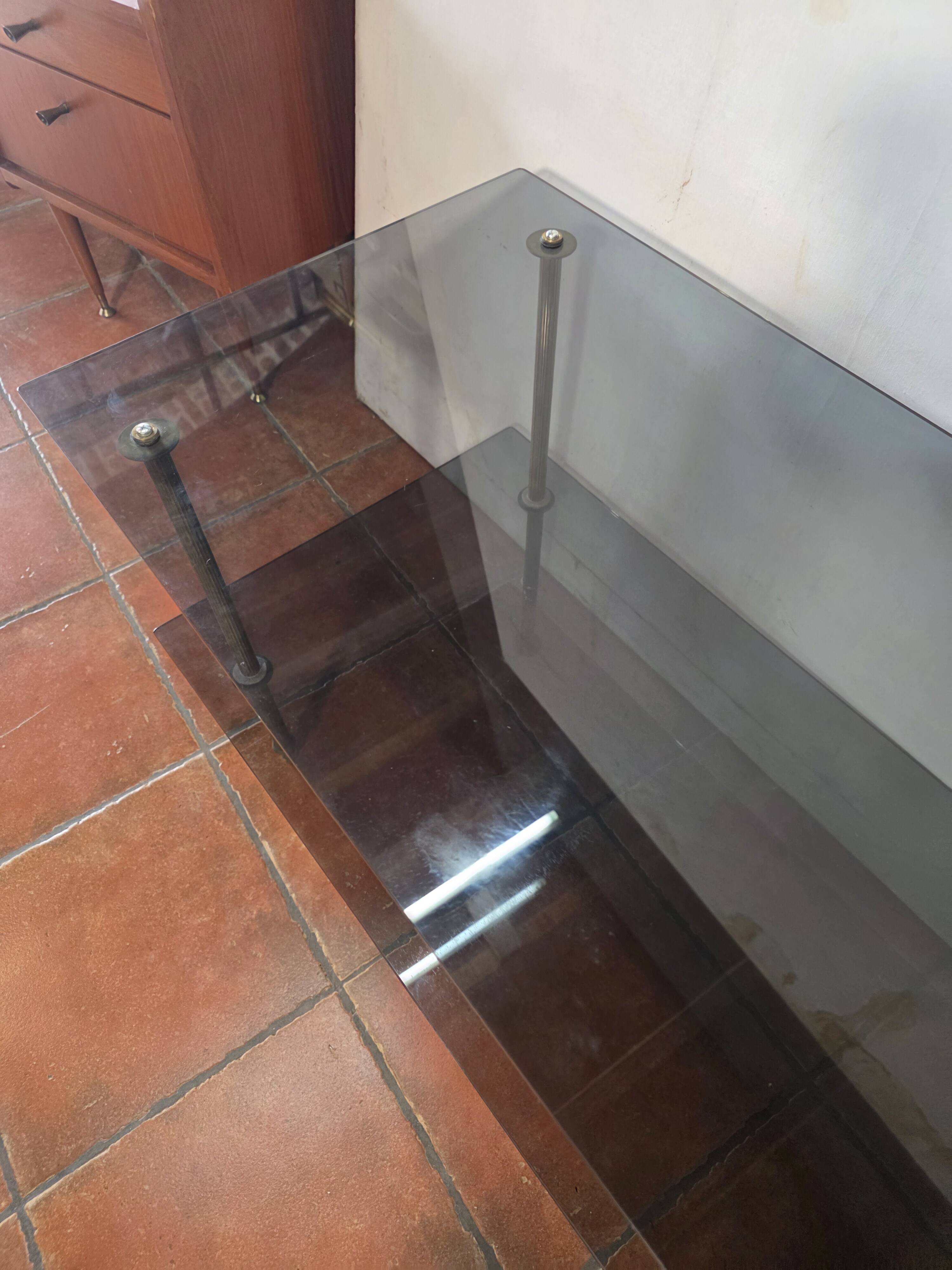 Smoked glass and brass coffee table from the 1970s.