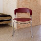 Red plastic-seat stacking chair with chrome frame by Paolo Favaretto for Assisa (Italy 1986) – vintage design