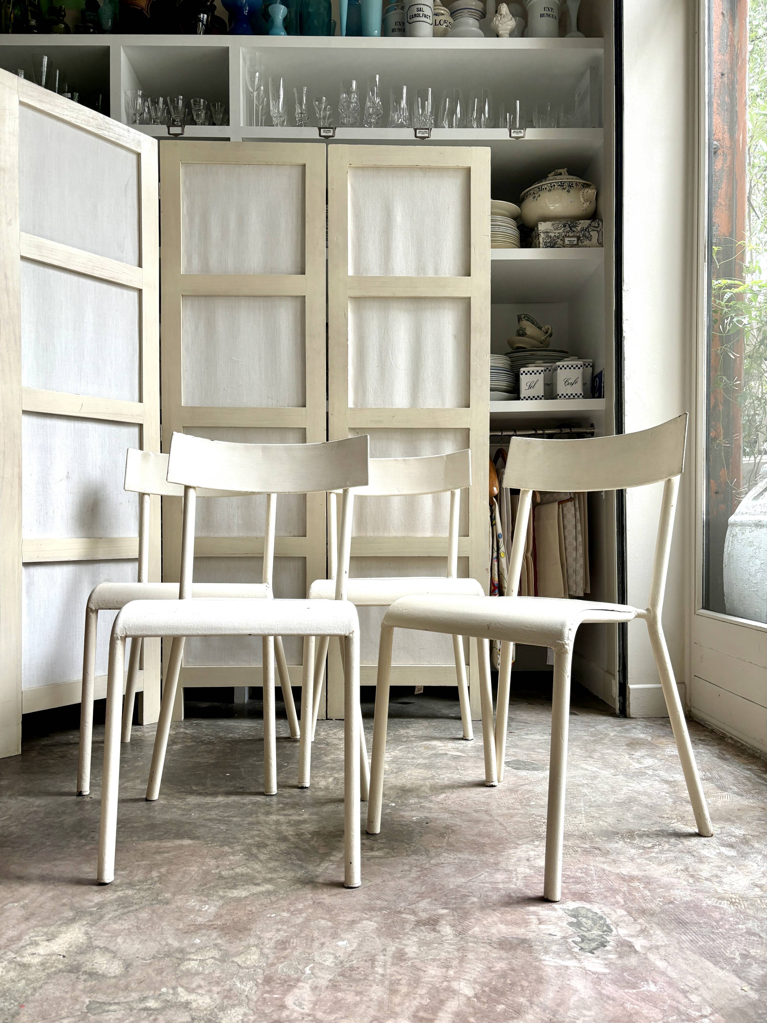 4 beige metal garden chairs