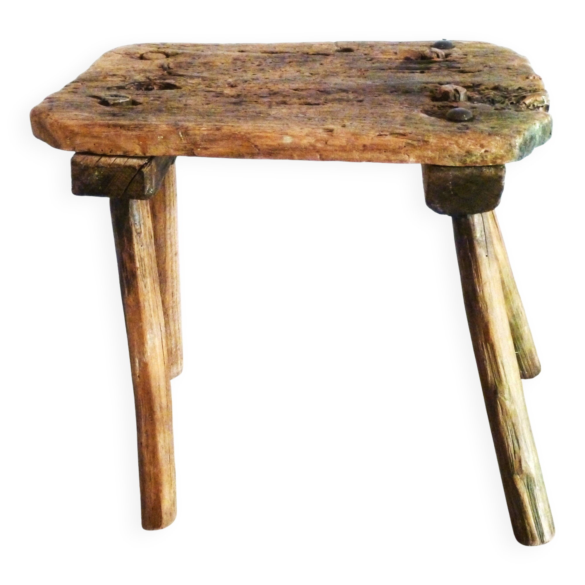Old milking stool, old farm stool, primitive art.
