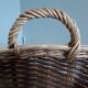 Very large oval laundry basket in two-tone braided wicker with handles