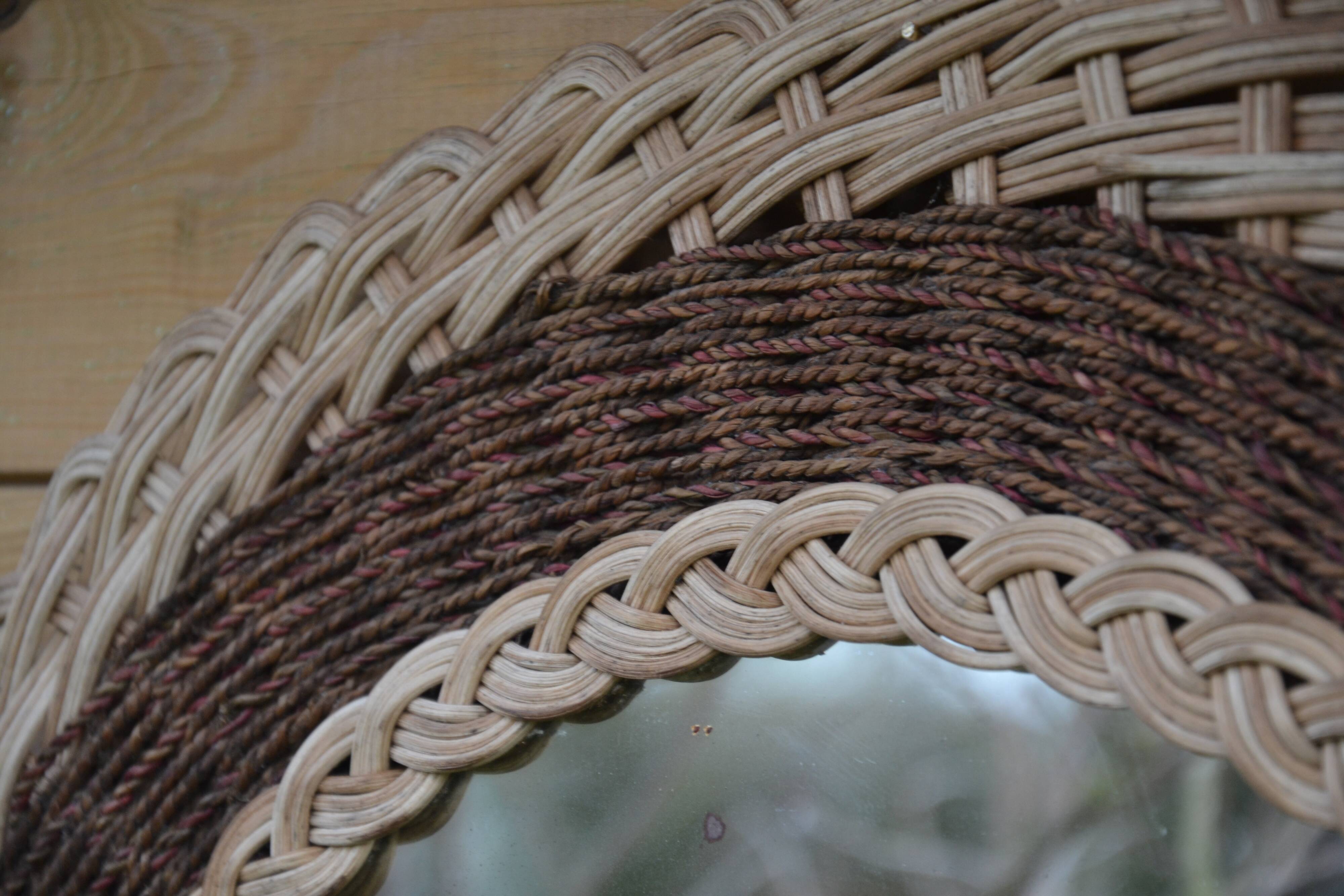 Round woven rattan mirror with rope from the 1970s.