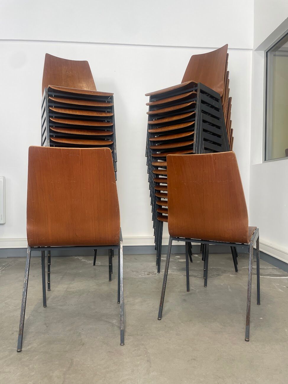 Set of 33 stackable wooden chairs 70s, origin Germany.