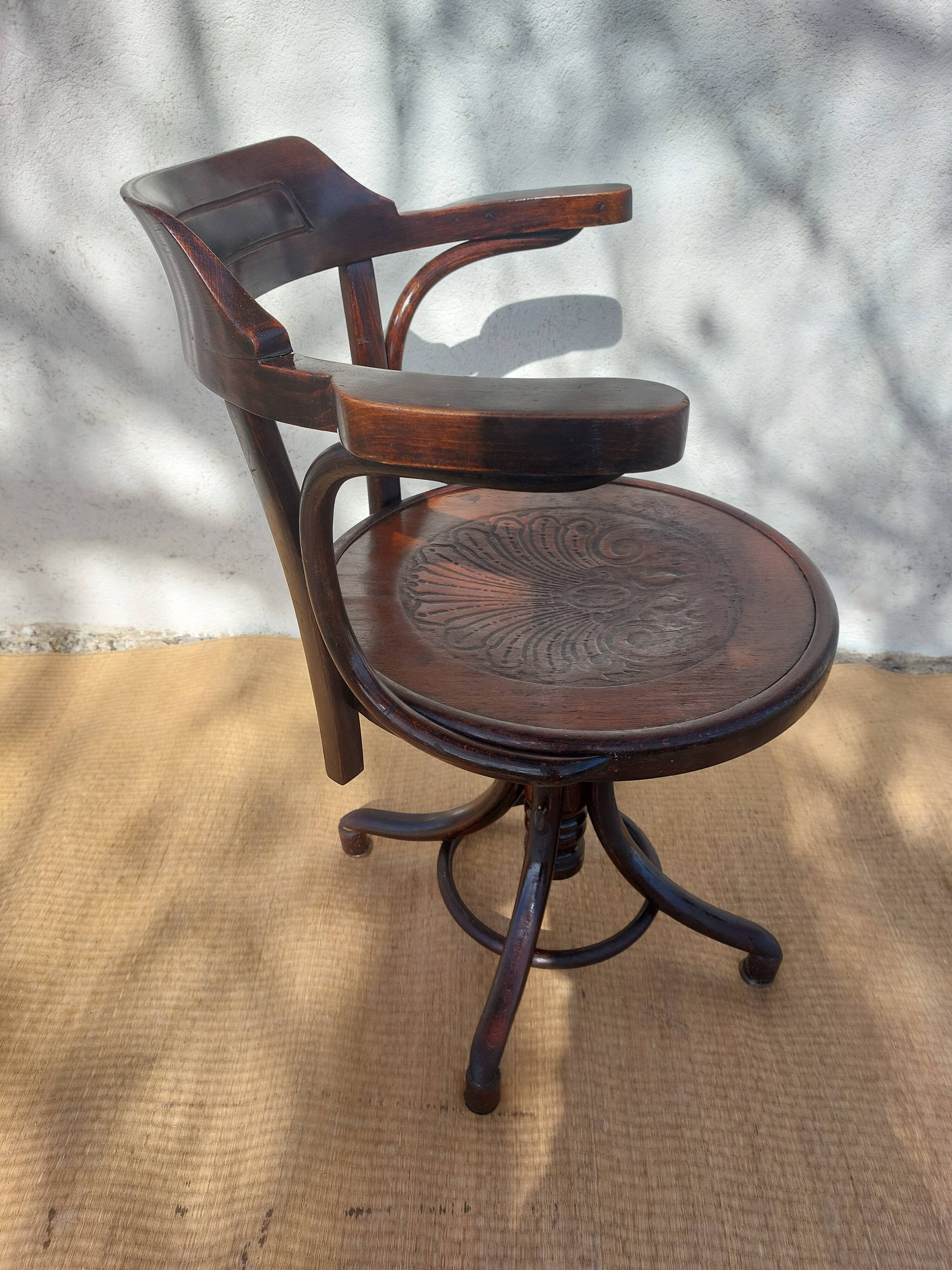 Swivel wooden armchair, pattern on seat