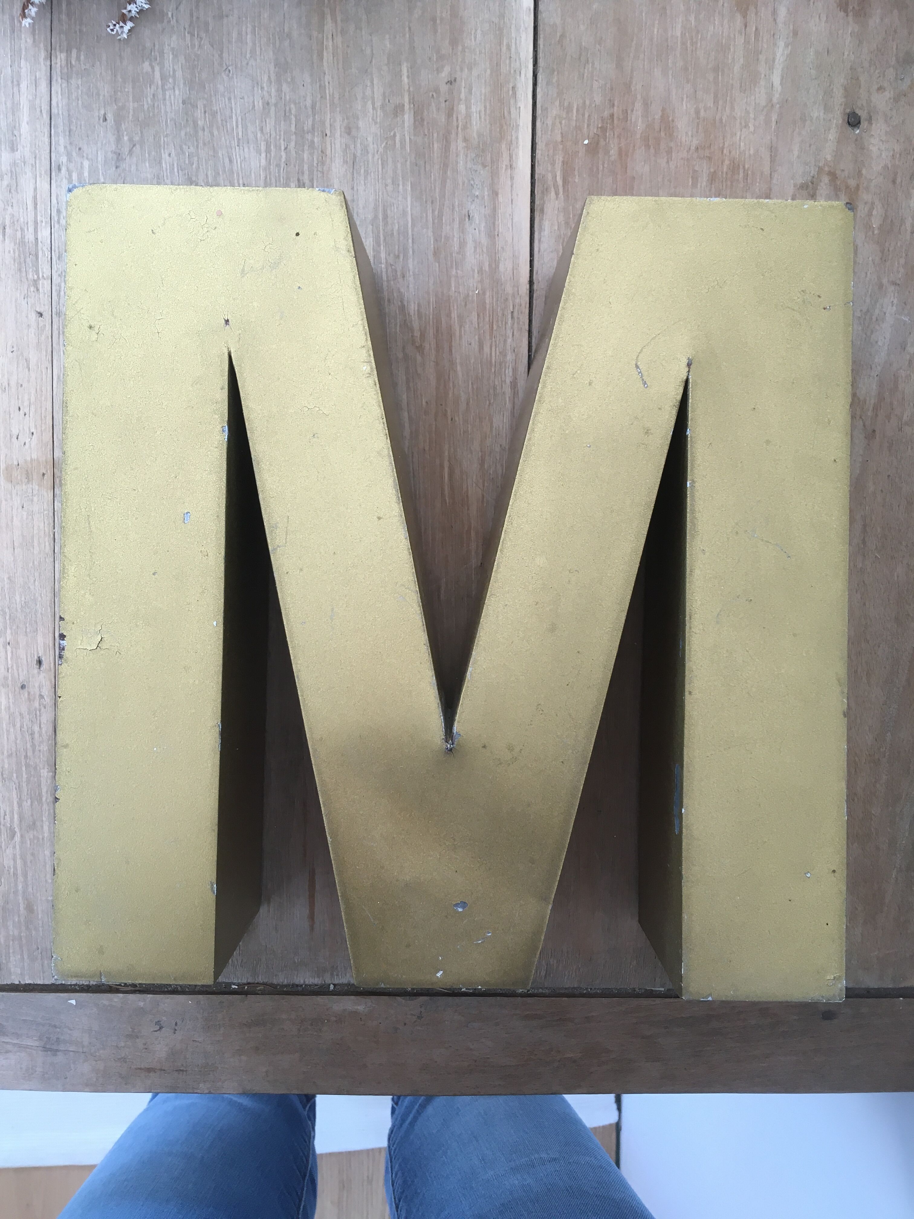 Golden vintage sign letter M
