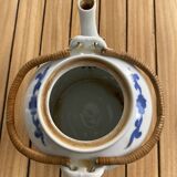 Asian teapot in basket