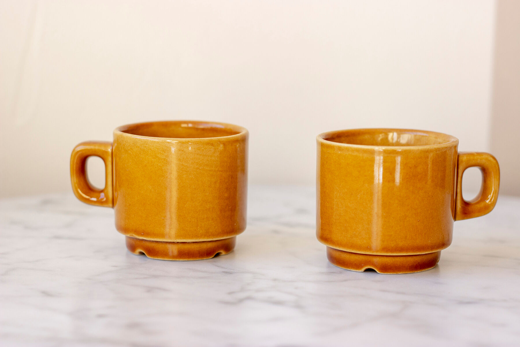 Pair of ochre yellow coffee cups