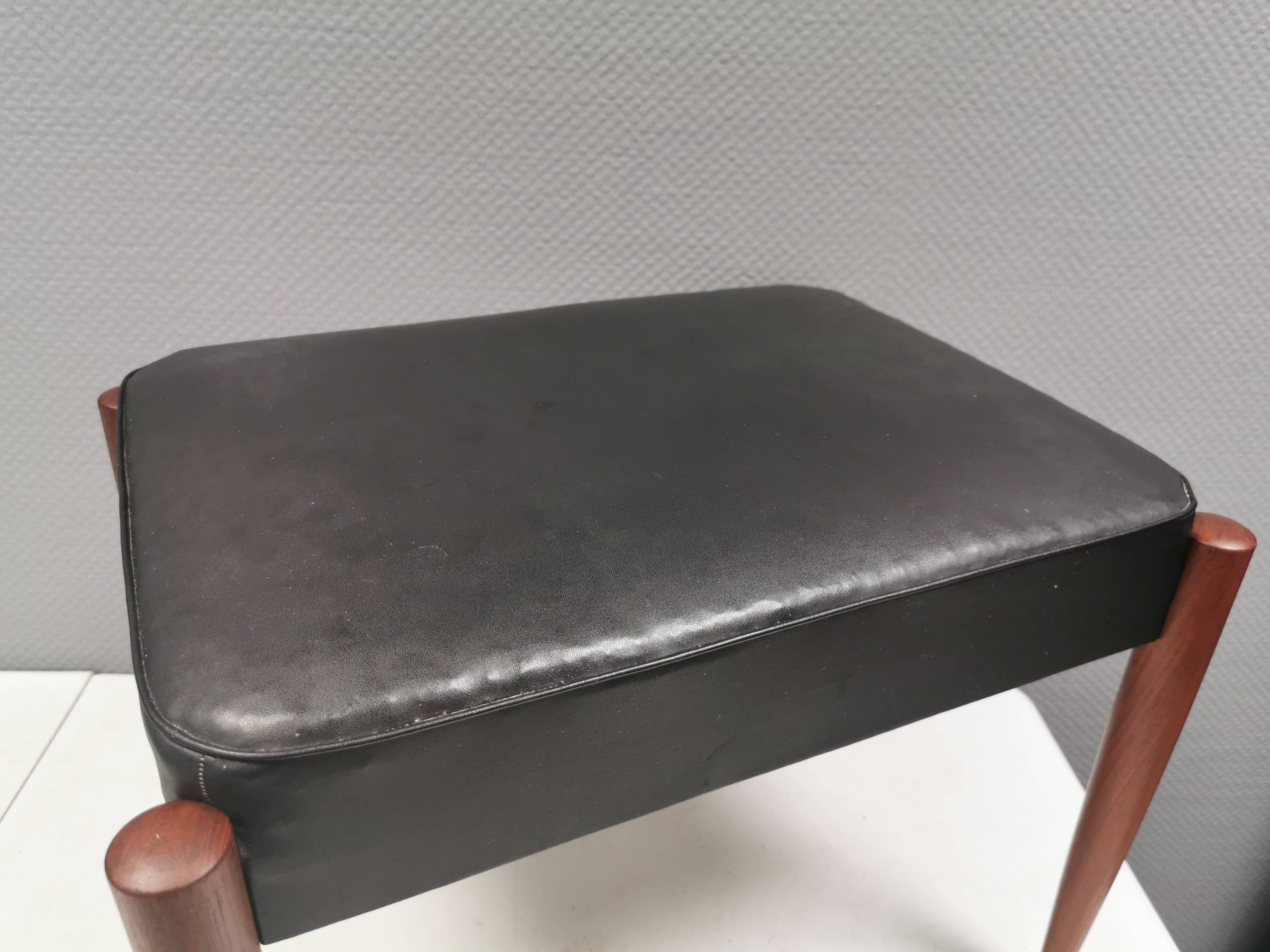 Footstool with teak wood legs and black skai (imitation leather) 1970s
